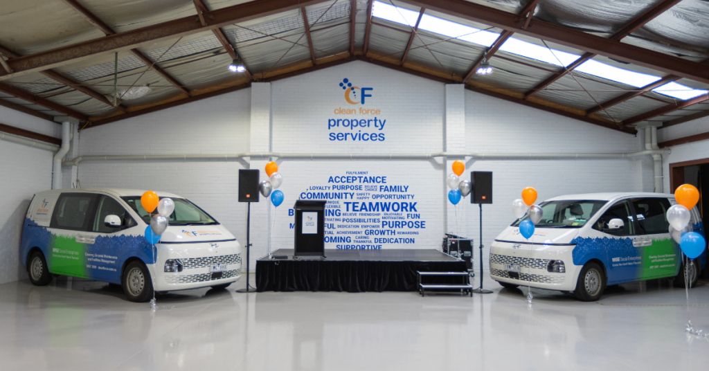 Stage set up with two Clean Force vans on either side at Clean Force Heidelberg deopt